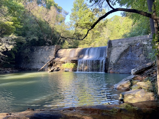 a large waterfall is coming out of the water