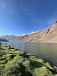 a view of a mountain range and a body of water