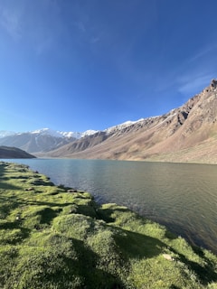 a view of a mountain range and a body of water