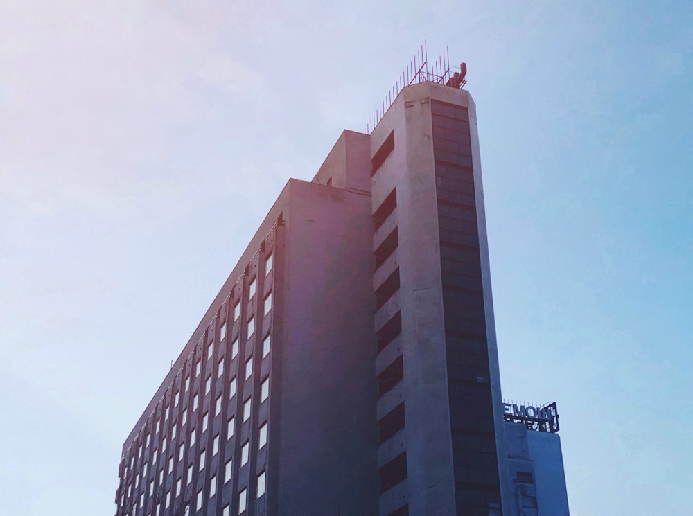 a tall building with a sky background