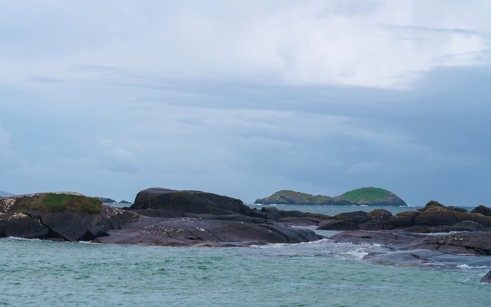 a large body of water surrounded by rocks