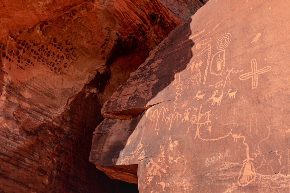 a rock with some drawings on it