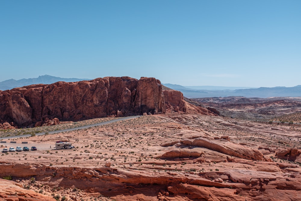 a group of cars parked in the middle of a desert