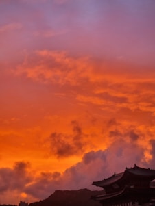 A dramatic aerial shot of Marrakech cityscape at sunset showcasing vibrant colors and architecture.