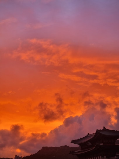 A dramatic aerial shot of Marrakech cityscape at sunset showcasing vibrant colors and architecture.