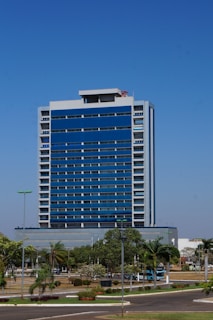 a very tall blue building sitting in the middle of a street