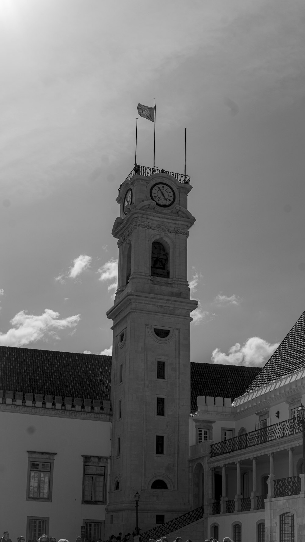 a clock tower with a flag on top of it