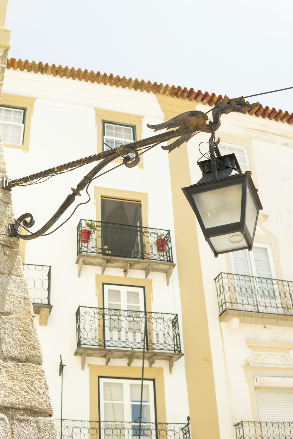 a street light hanging from the side of a building