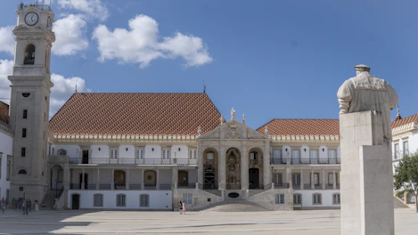 a large white building with a clock tower