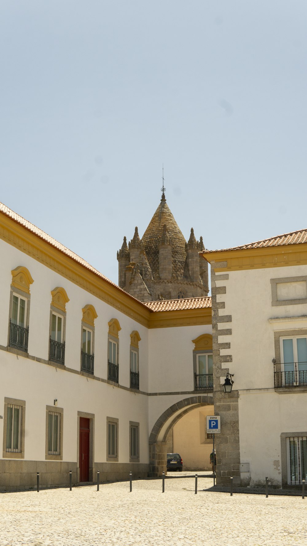 a large white building with a red door