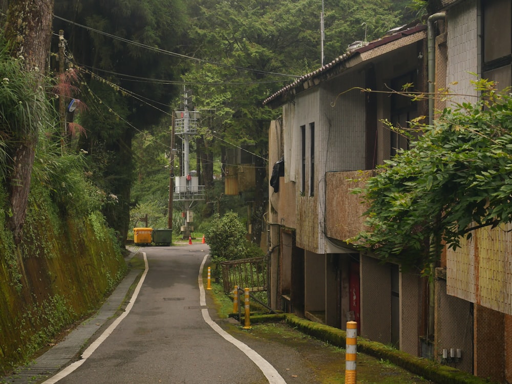 a narrow road with a building on the side of it