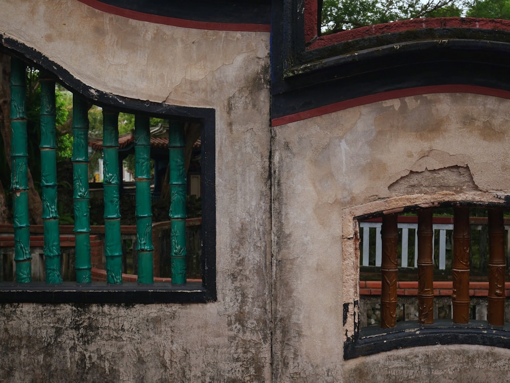 a window with bars on the side of a building