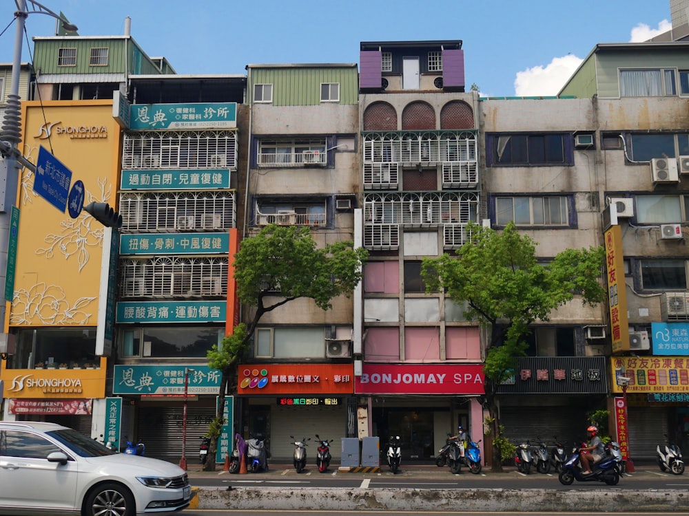 a large building with a bunch of signs on the side of it