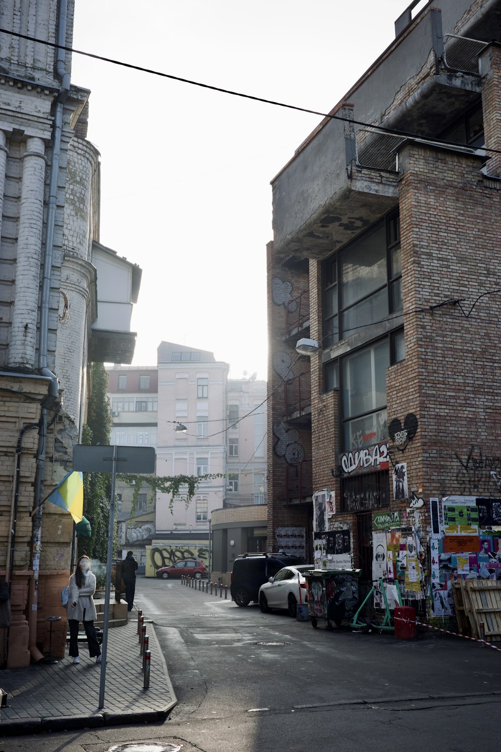 a city street with people walking on the sidewalk