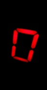 A glowing red digital number zero on a black background, made up of illuminated segments often found in LED displays.