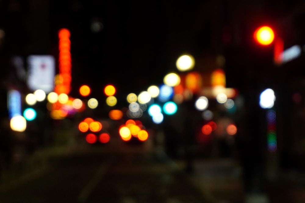 a blurry photo of a city street at night