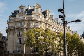 a tall building with many windows and balconies