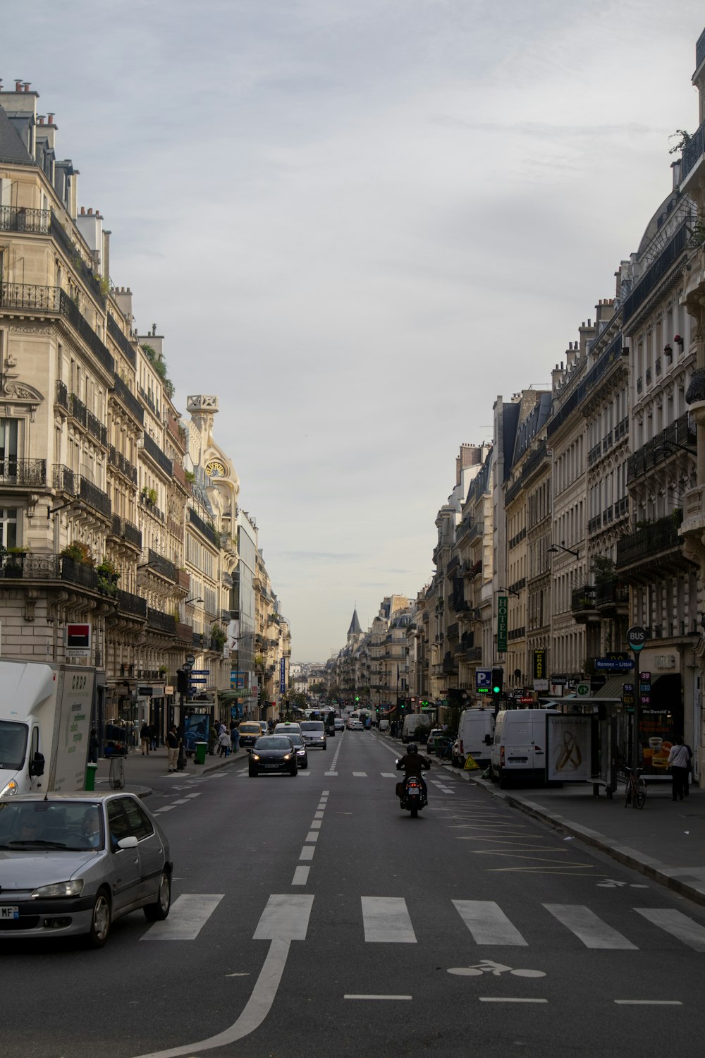 a city street filled with lots of tall buildings