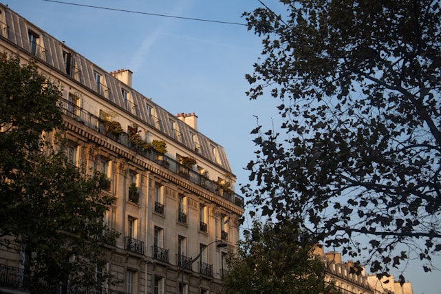 A cozy Brussels apartment with a view of the city skyline at sunset.