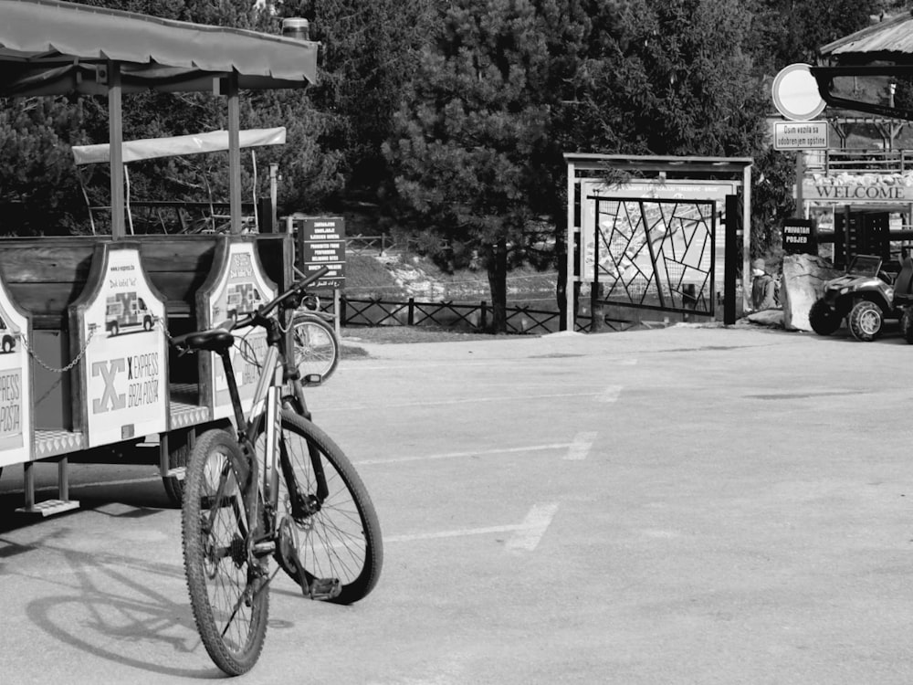 a bicycle parked next to a food truck