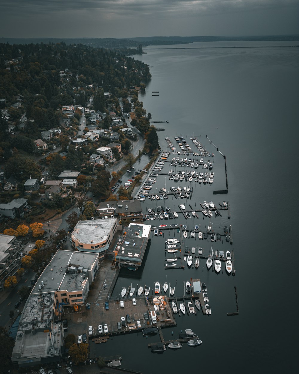 a harbor filled with lots of boats under a cloudy sky