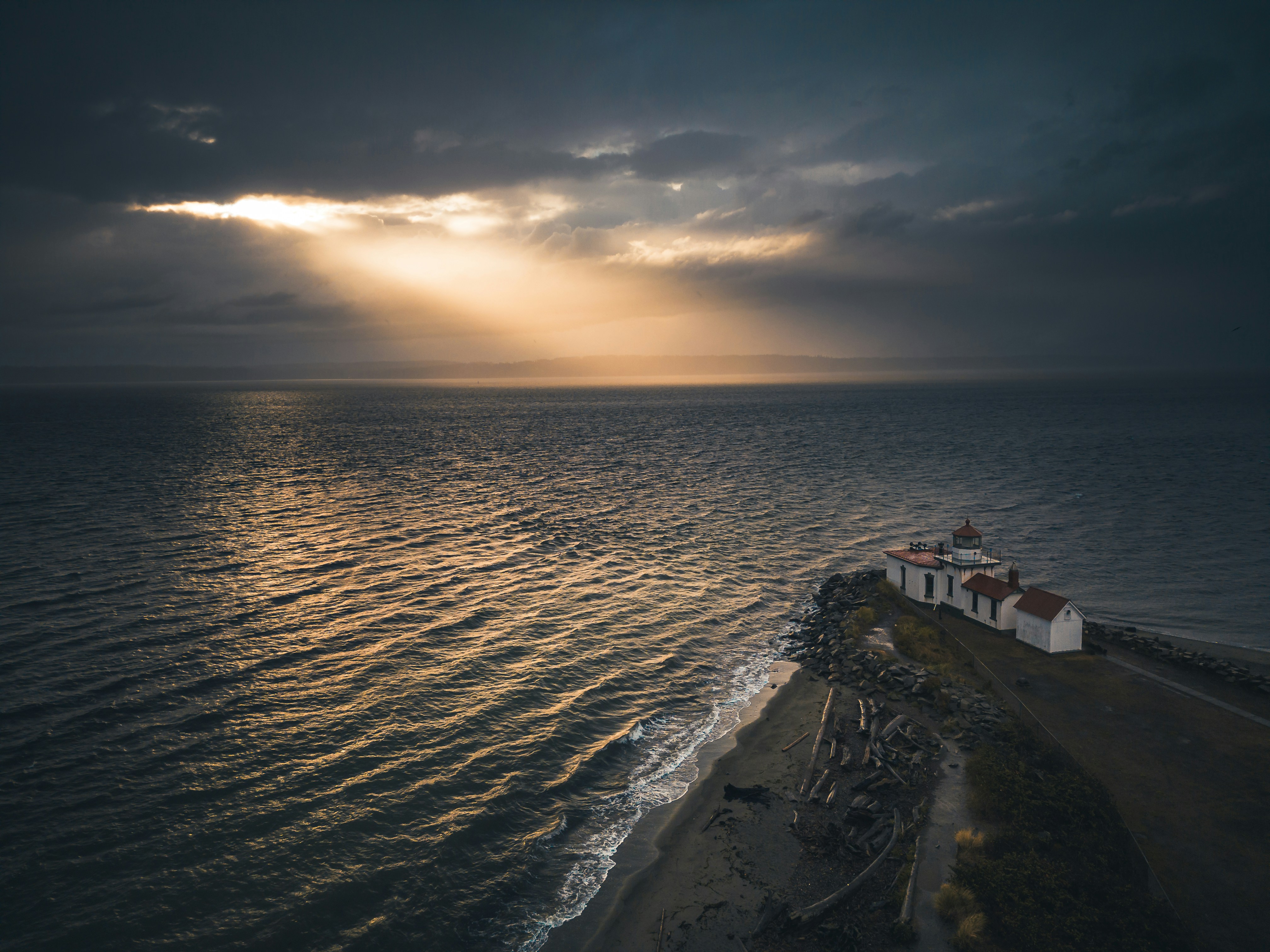 A house on a small island in the middle of the ocean photo – Free Sea ...
