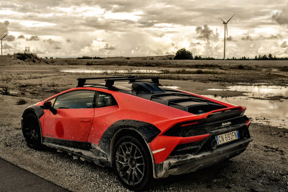 a red sports car parked on the side of a road