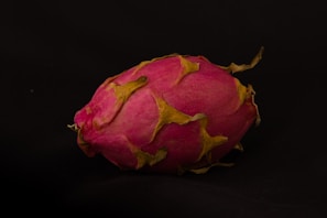 Golden Israel dragon fruit glowing vibrantly against a backdrop of clear blue South African sky