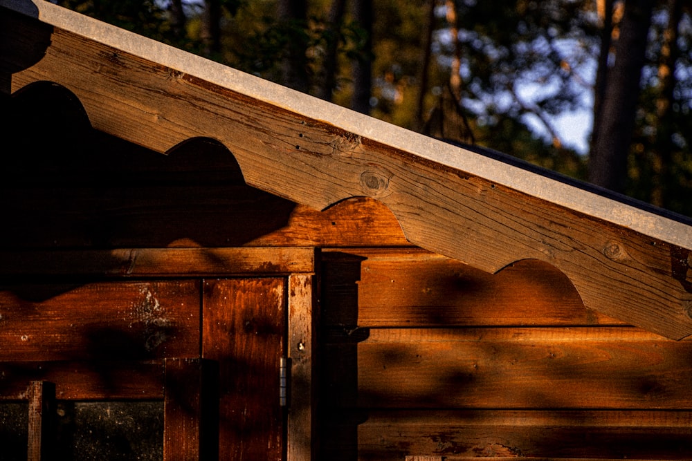 a close up of a wooden structure with a sky background