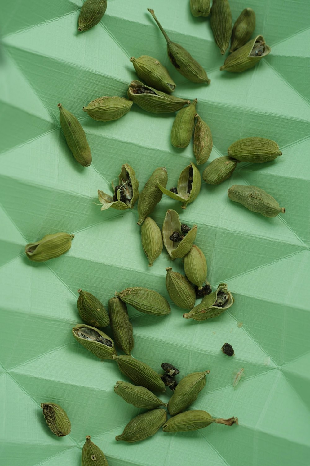a bunch of nuts on a green surface