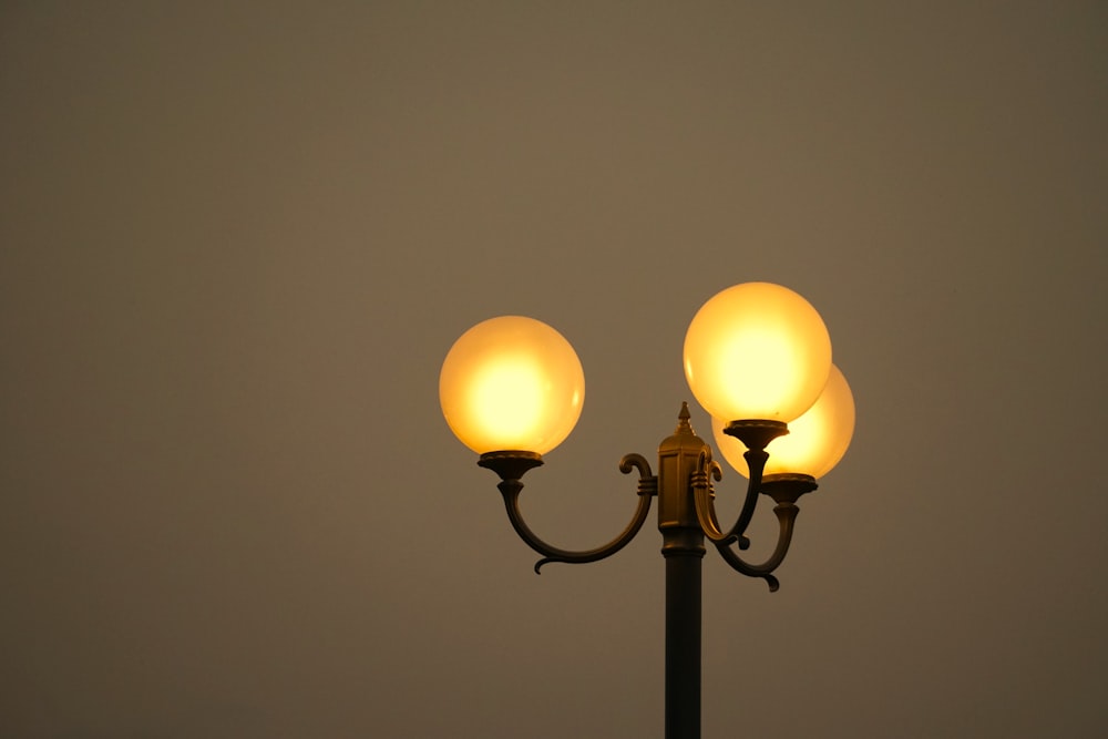 a street light with two lights on each of it's sides