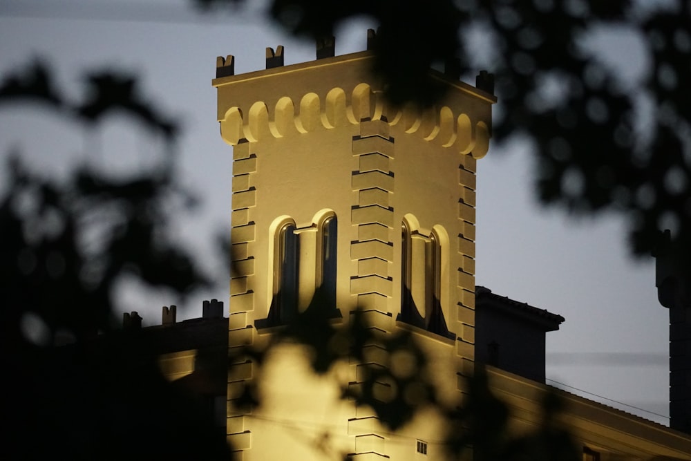 a tall building with a clock on the top of it