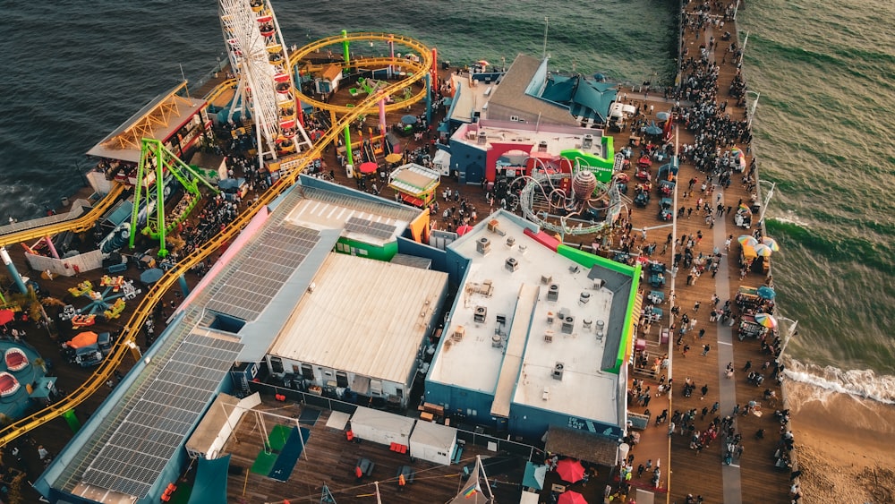 an aerial view of an amusement park near the ocean