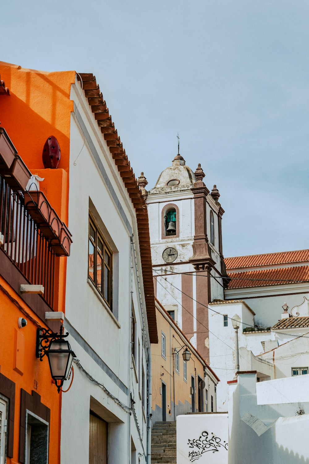 a building with a clock tower in the background