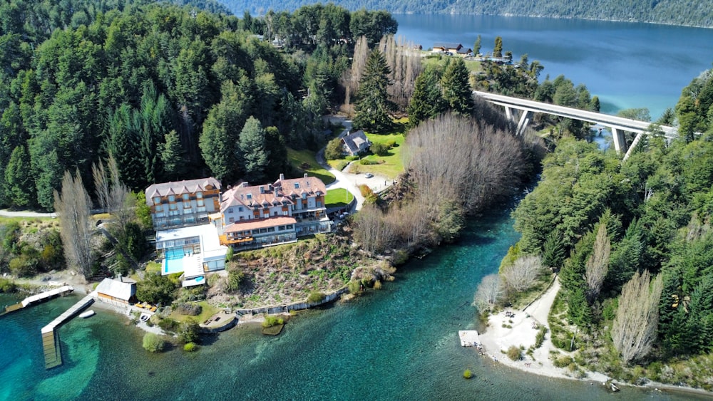 an aerial view of a house and a bridge