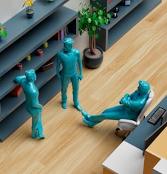 a group of blue statues sitting on top of a wooden floor