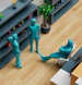 a group of blue statues sitting on top of a wooden floor