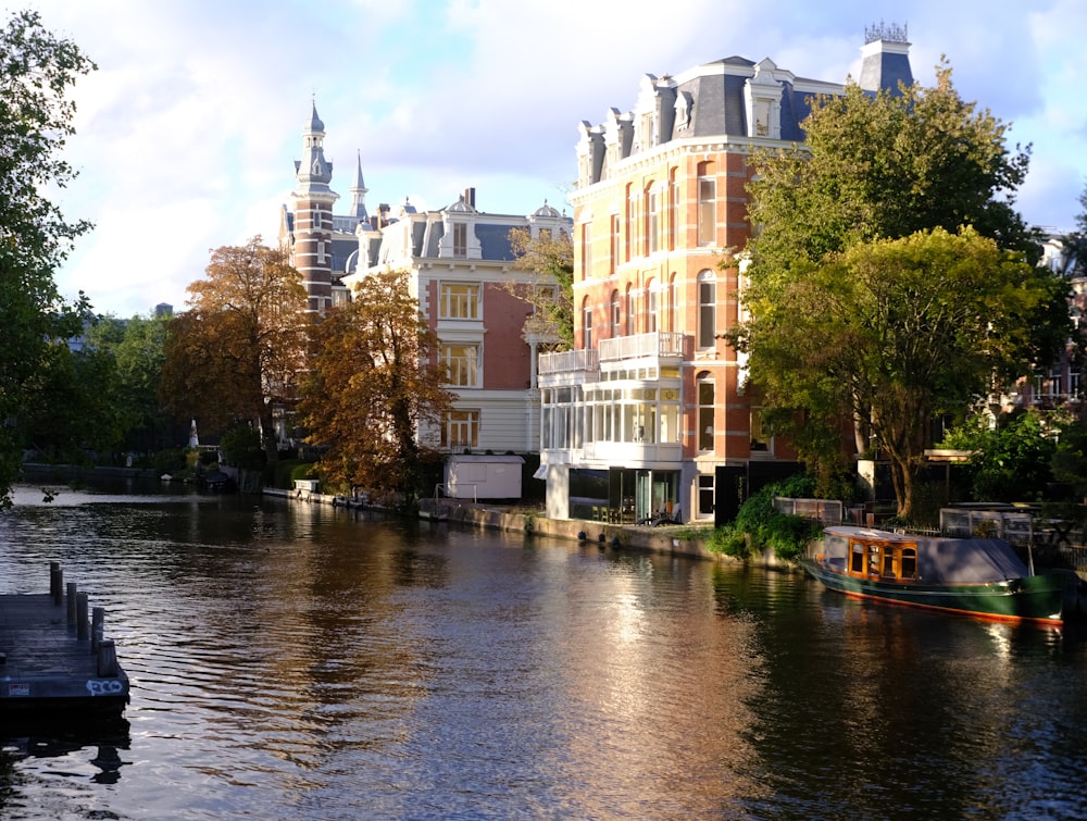 a river running through a city next to tall buildings