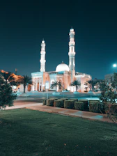 Serene image of Masjid Nabawi with golden lighting at dusk.