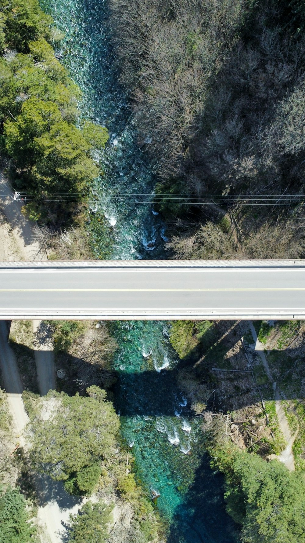 an aerial view of a bridge over a river