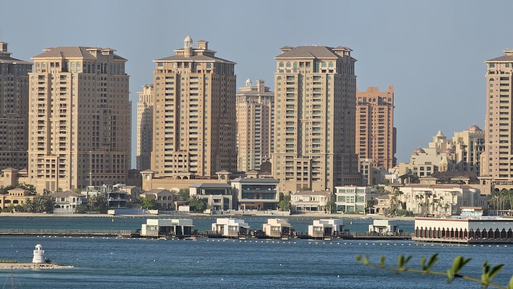 a body of water with a bunch of buildings in the background