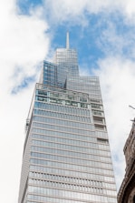 a very tall building with a sky background