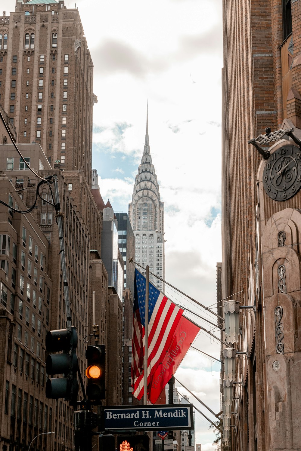 a city street with tall buildings and a traffic light