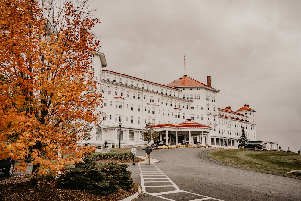 a large white building with a red roof