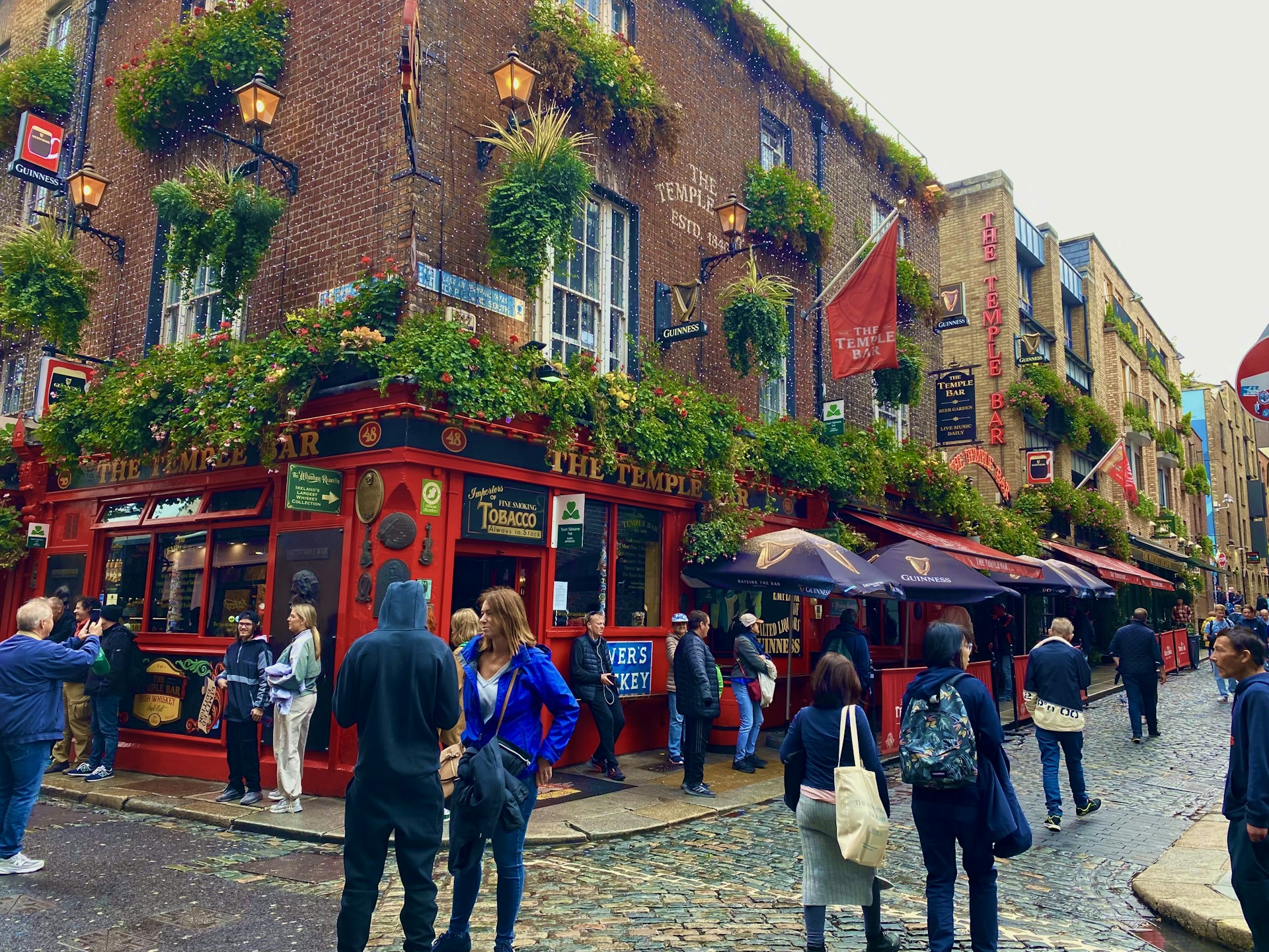 woman wearing yellow long-sleeved dress under white clouds and blue sky during daytime