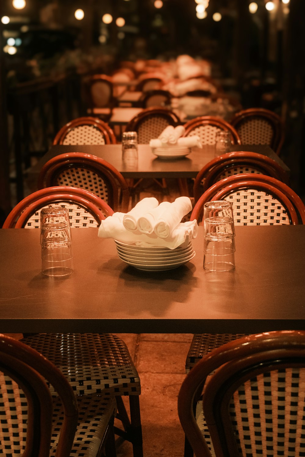 a long table with plates and glasses on it