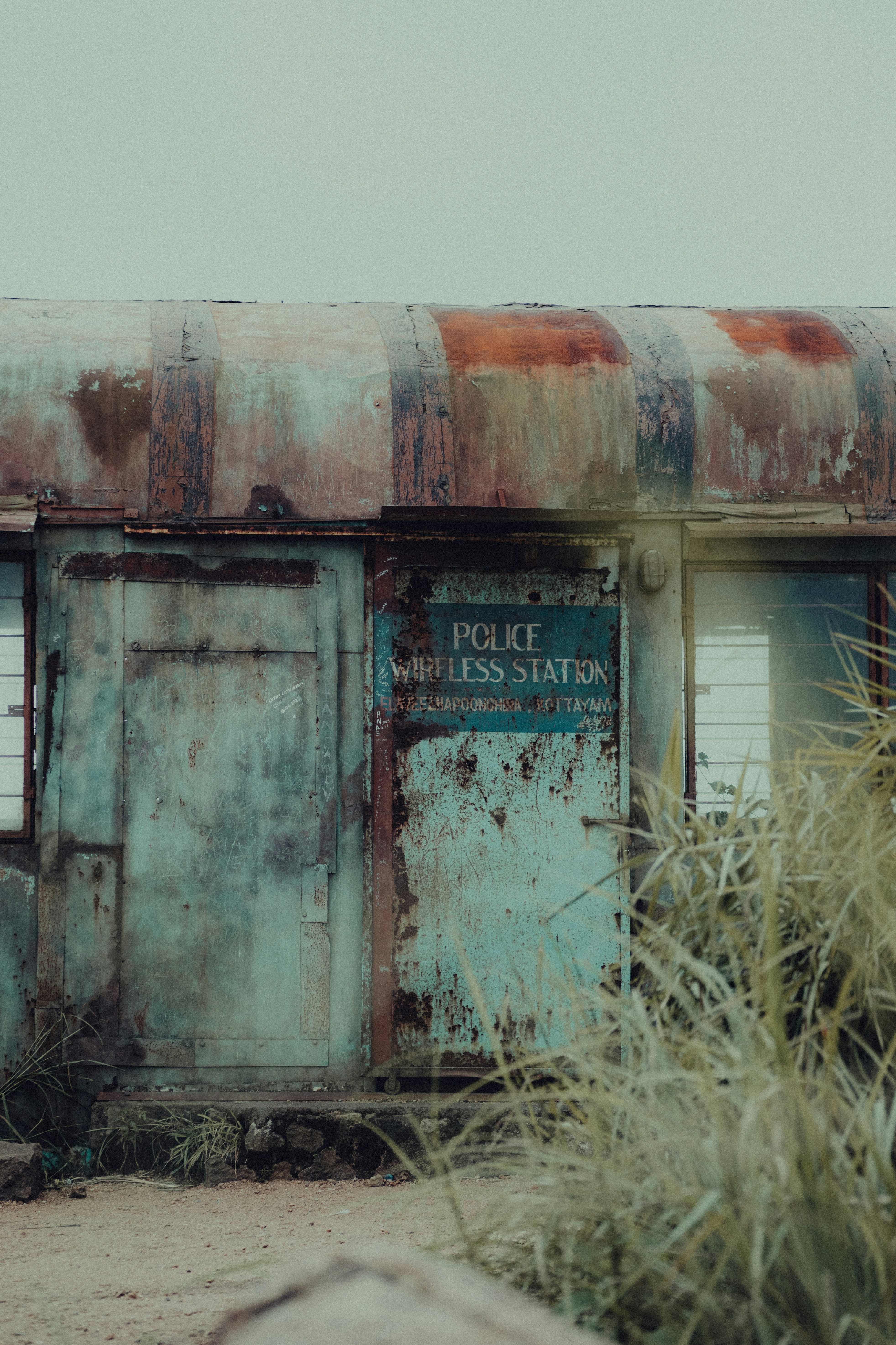 an old run down building with a sign on it