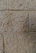 Close-up of textured wall with modern thermal insulation coating in neutral tones.