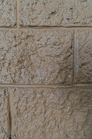 Close-up of textured wall with modern thermal insulation coating in neutral tones.