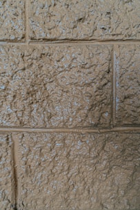 Close-up of textured wall covering with resin finish in neutral colors